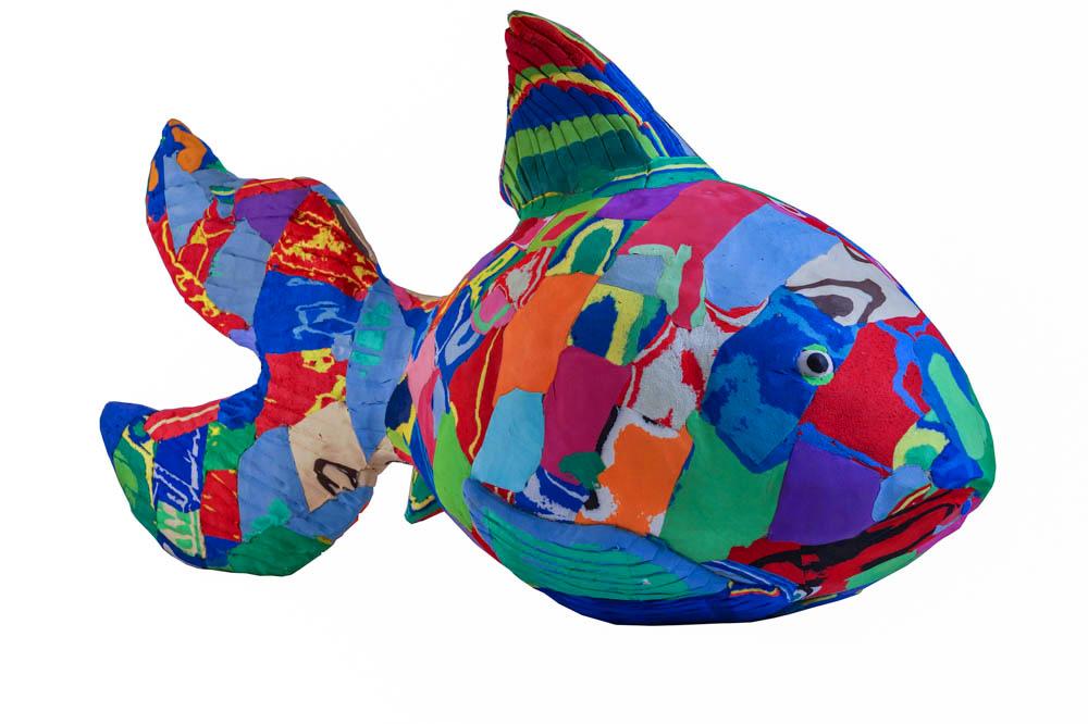 Hand-carved multicolored reef fish sculpture made of upcycled flip flops by Ocean Sole.